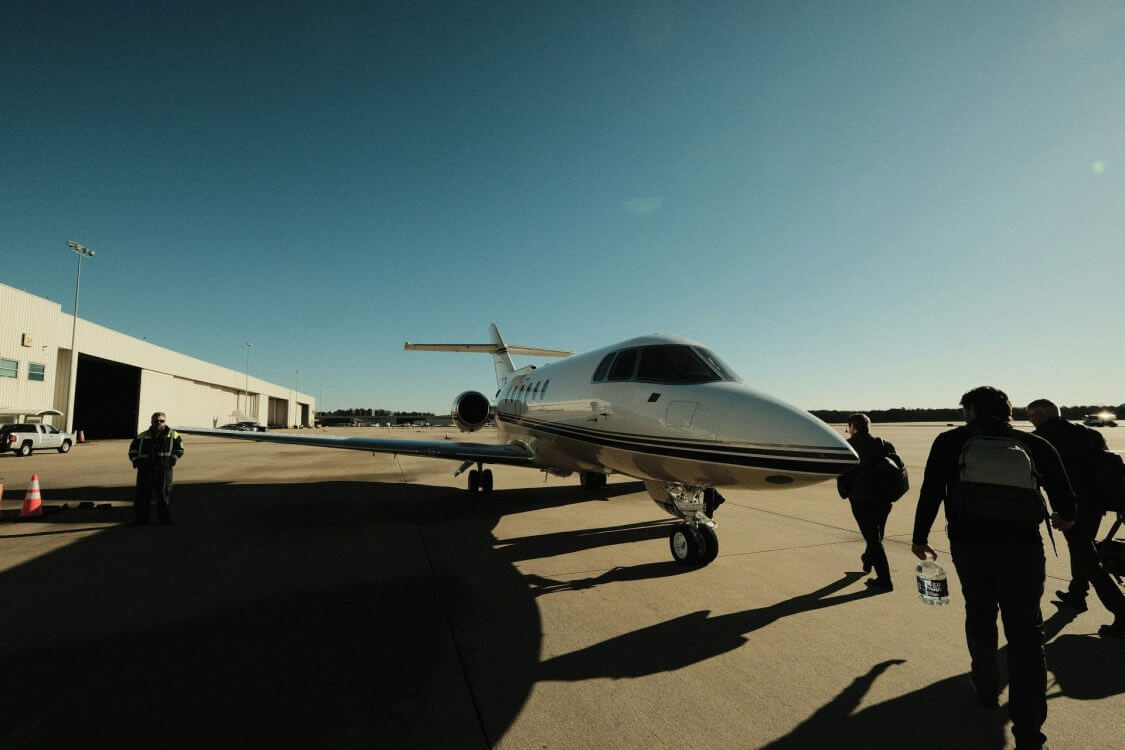 Business men boarding a private jet